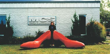 Oversize red slippers. Painted EPS foam.